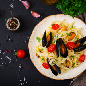 seafood fettuccine pasta with mussels over black b 2023 11 27 05 18 22 utc scaled